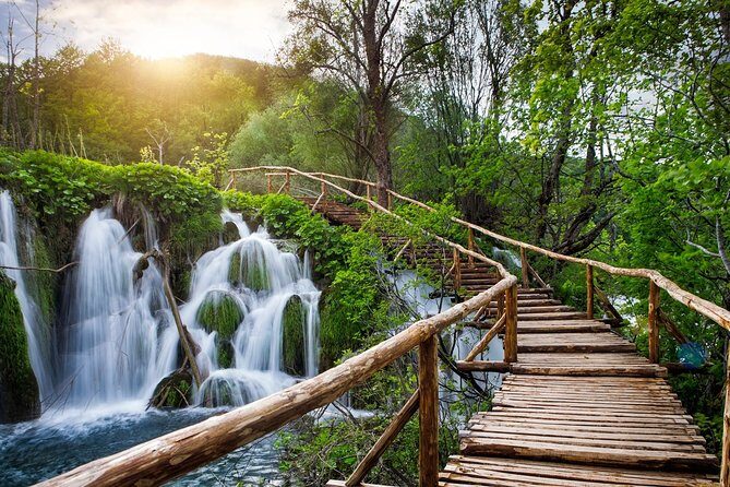 Private Plitvice Lakes Tour - Day Trip from Zagreb (entrance ticket included) - Walking into the lakes: pine, beech, spruce, bridges, and falls